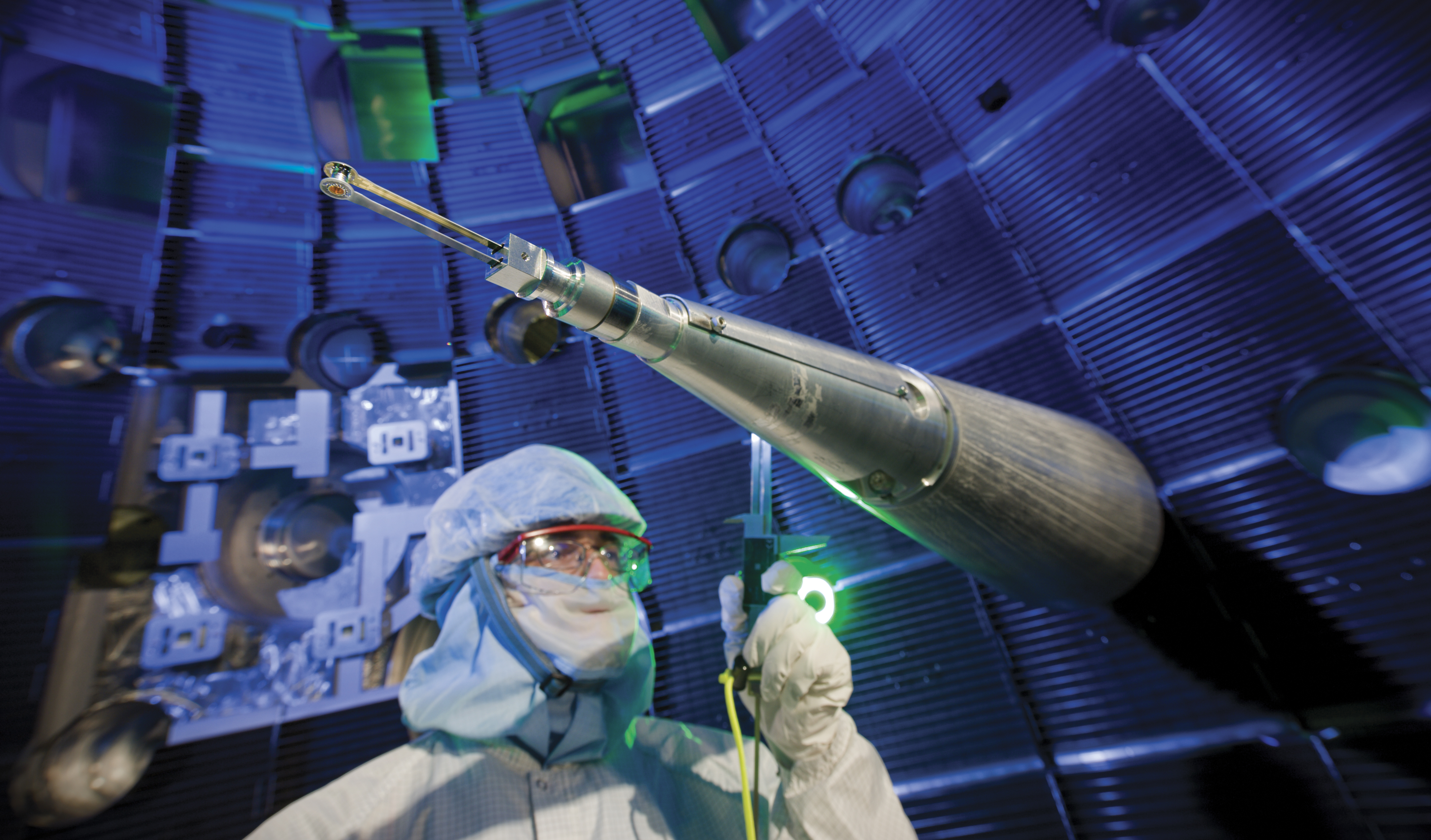 A worker inside the National Ignition Facility's target chamber
