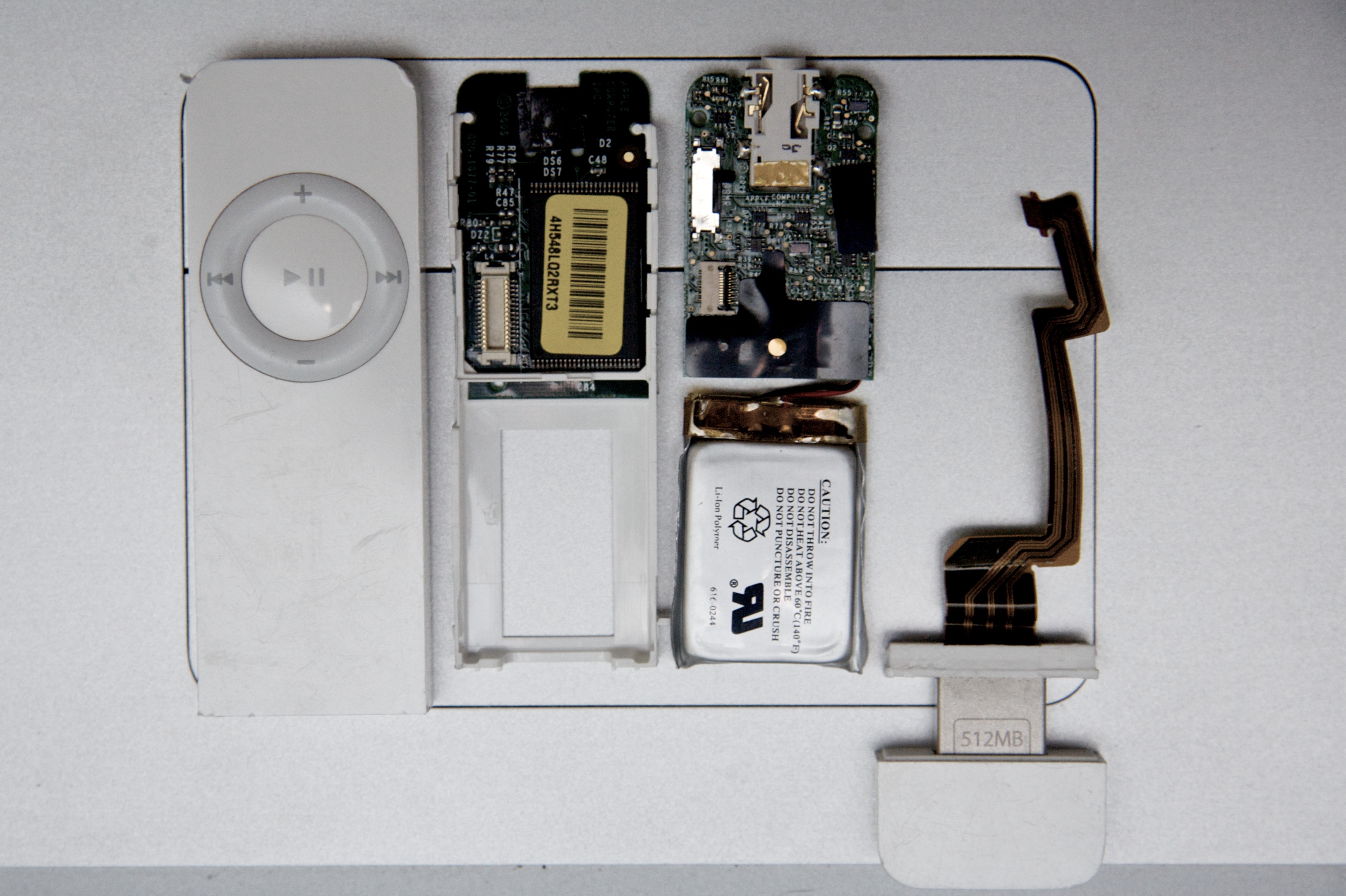 A first-generation iPod Shuffle opened up